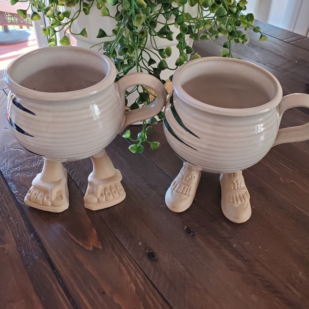2-Cute, little feet, pottery, coffee cups. Stand very sturdy, like any cup.